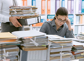Image. Staff overwhelmed by paperwork