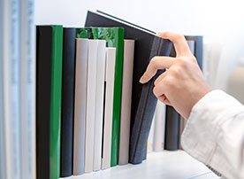 Image. Selecting a book from a shelf